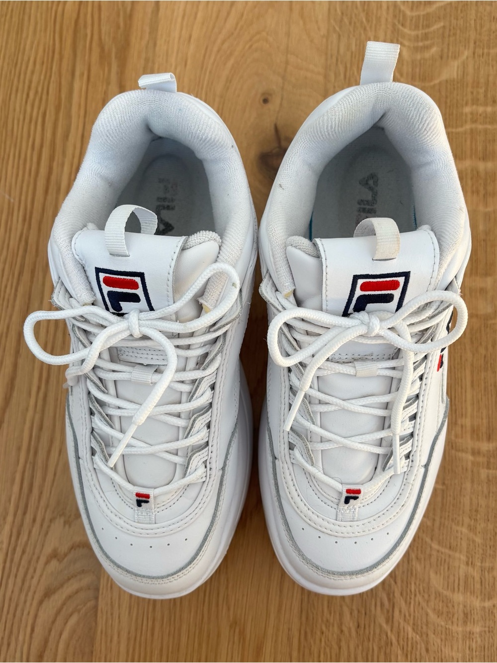 Fila women’s White Sneakers with Navy and Red Logo Accents